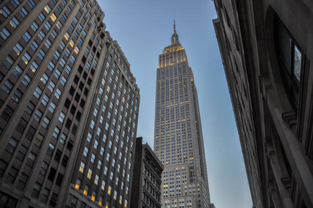 The Empire State Building is a 102-story Art Deco skyscraper in Midtown Manhattan, New York City. Designed by Shreve, Lamb & Harmon and completed in 1931, the building has a roof height of 1,250 feet (380 m) and stands a total of 1,454 feet (443.2 m) tall, including its antenna